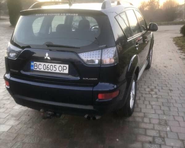 Синий Мицубиси Аутлендер, объемом двигателя 2 л и пробегом 235 тыс. км за 8800 $, фото 2 на Automoto.ua