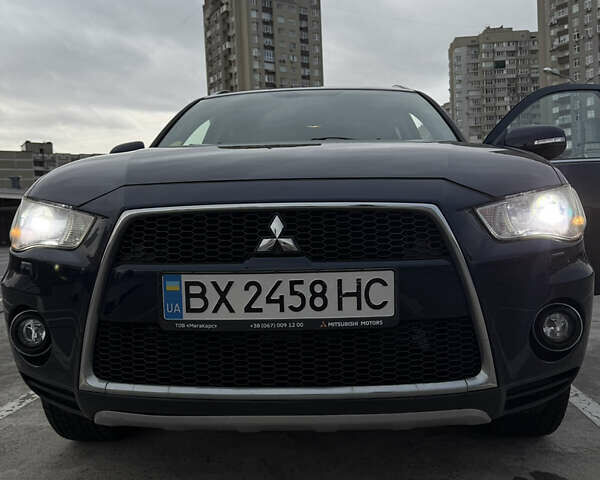 Синий Мицубиси Аутлендер, объемом двигателя 2.2 л и пробегом 213 тыс. км за 12000 $, фото 9 на Automoto.ua