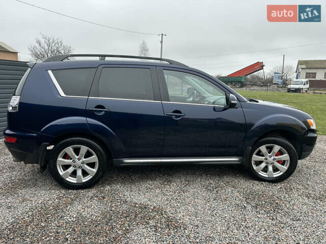 Синий Мицубиси Аутлендер, объемом двигателя 2.3 л и пробегом 202 тыс. км за 11650 $, фото 6 на Automoto.ua