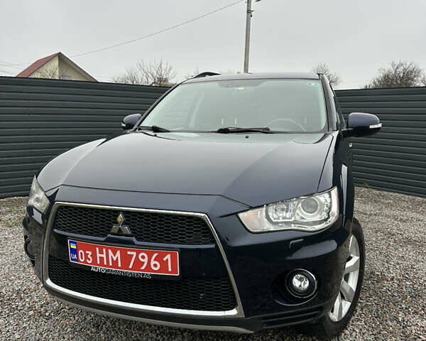 Синий Мицубиси Аутлендер, объемом двигателя 2.3 л и пробегом 202 тыс. км за 11650 $, фото 2 на Automoto.ua