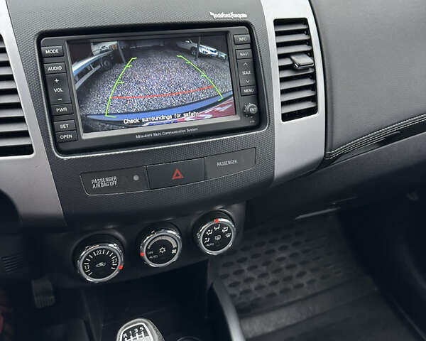 Синий Мицубиси Аутлендер, объемом двигателя 2.3 л и пробегом 202 тыс. км за 11650 $, фото 33 на Automoto.ua