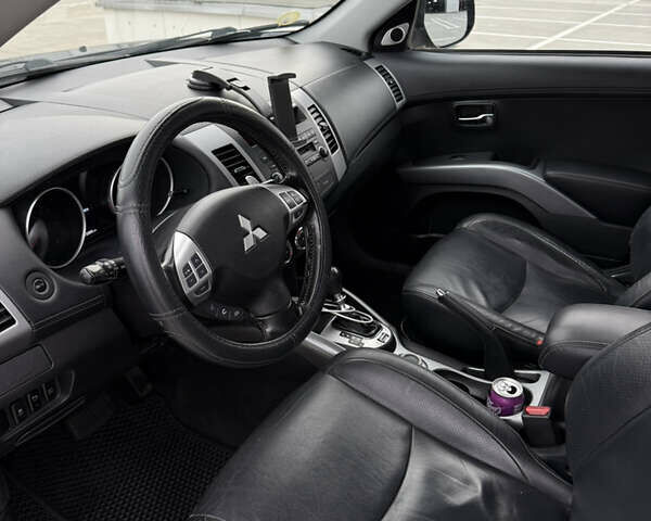 Синий Мицубиси Аутлендер, объемом двигателя 2.2 л и пробегом 213 тыс. км за 12000 $, фото 18 на Automoto.ua