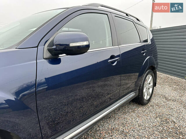 Синий Мицубиси Аутлендер, объемом двигателя 2.3 л и пробегом 202 тыс. км за 11650 $, фото 8 на Automoto.ua