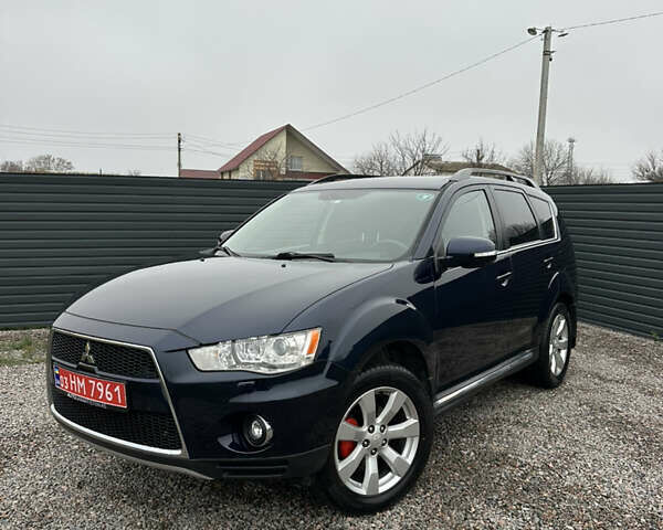 Синий Мицубиси Аутлендер, объемом двигателя 2.3 л и пробегом 202 тыс. км за 11650 $, фото 1 на Automoto.ua