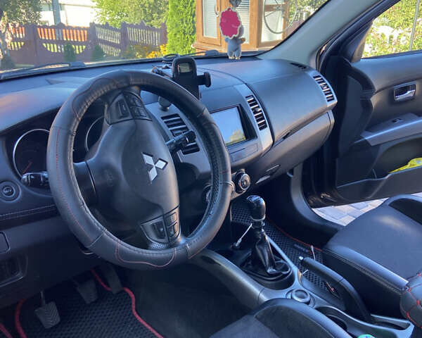 Синий Мицубиси Аутлендер, объемом двигателя 2.27 л и пробегом 262 тыс. км за 10900 $, фото 11 на Automoto.ua