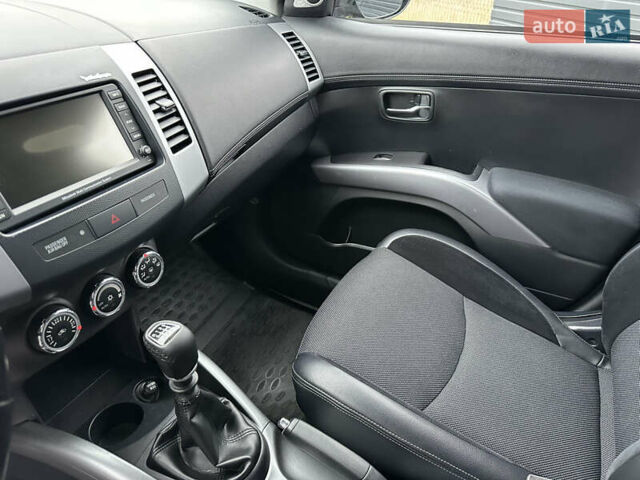 Синий Мицубиси Аутлендер, объемом двигателя 2.3 л и пробегом 202 тыс. км за 11650 $, фото 17 на Automoto.ua
