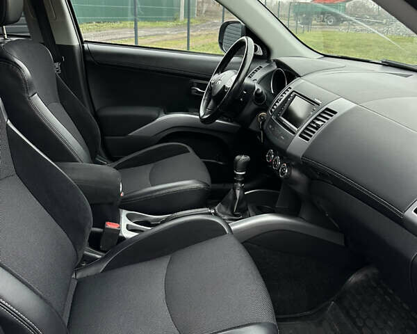 Синий Мицубиси Аутлендер, объемом двигателя 2.3 л и пробегом 202 тыс. км за 11650 $, фото 26 на Automoto.ua