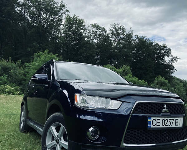 Синий Мицубиси Аутлендер, объемом двигателя 2.27 л и пробегом 262 тыс. км за 10900 $, фото 2 на Automoto.ua