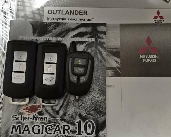 Синій Міцубісі Аутлендер, об'ємом двигуна 2.36 л та пробігом 183 тис. км за 14000 $, фото 20 на Automoto.ua