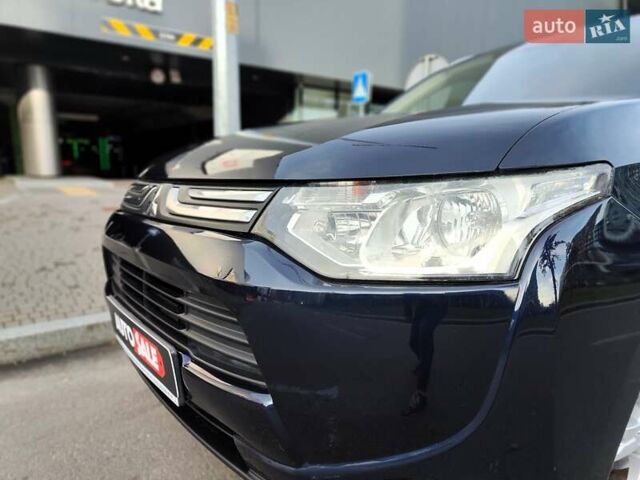 Синій Міцубісі Аутлендер, об'ємом двигуна 2.4 л та пробігом 213 тис. км за 10990 $, фото 1 на Automoto.ua