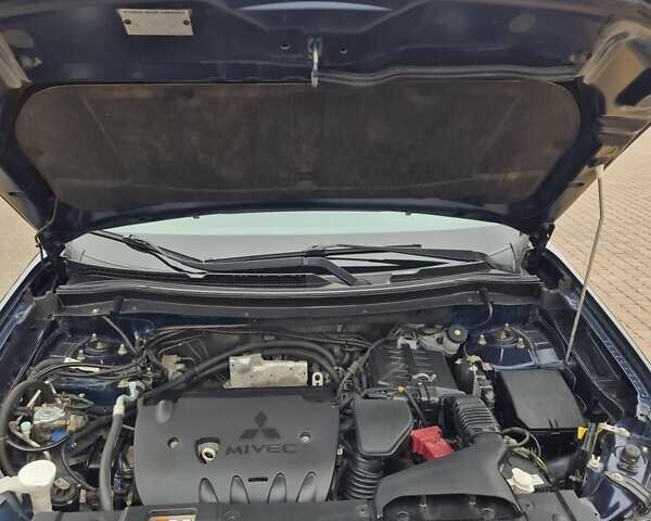 Синій Міцубісі Аутлендер, об'ємом двигуна 2.36 л та пробігом 183 тис. км за 14000 $, фото 19 на Automoto.ua