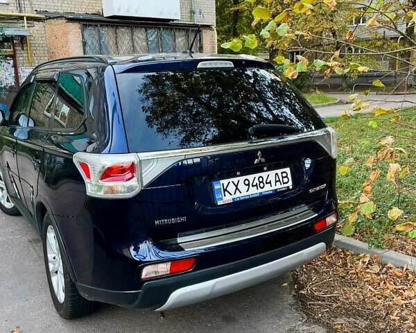 Синий Мицубиси Аутлендер, объемом двигателя 2.4 л и пробегом 230 тыс. км за 11300 $, фото 3 на Automoto.ua