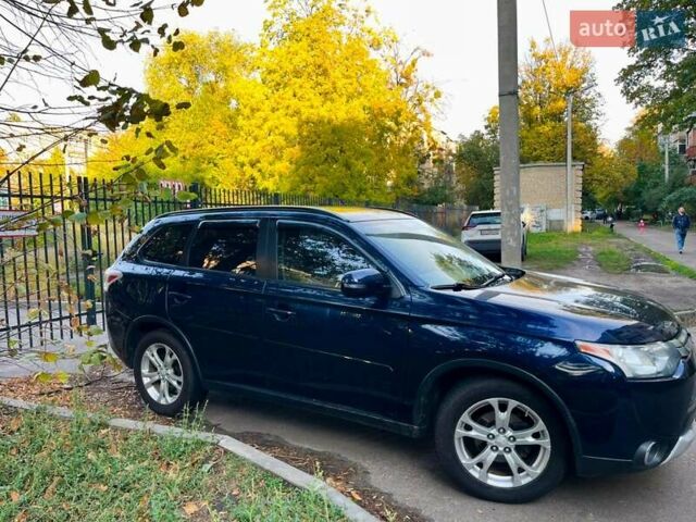 Синий Мицубиси Аутлендер, объемом двигателя 2.4 л и пробегом 230 тыс. км за 11300 $, фото 2 на Automoto.ua