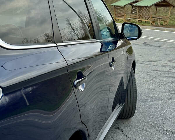 Синий Мицубиси Аутлендер, объемом двигателя 2 л и пробегом 218 тыс. км за 12550 $, фото 11 на Automoto.ua