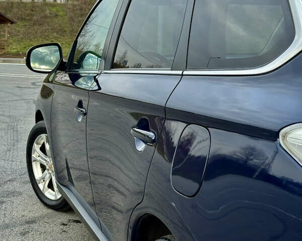 Синий Мицубиси Аутлендер, объемом двигателя 2 л и пробегом 218 тыс. км за 12550 $, фото 12 на Automoto.ua