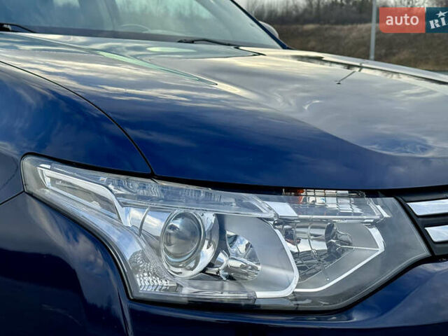 Синий Мицубиси Аутлендер, объемом двигателя 2 л и пробегом 218 тыс. км за 12550 $, фото 8 на Automoto.ua