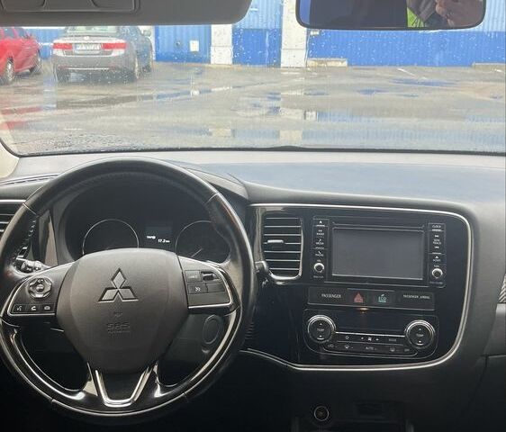 Синий Мицубиси Аутлендер, объемом двигателя 2.4 л и пробегом 202 тыс. км за 14300 $, фото 3 на Automoto.ua