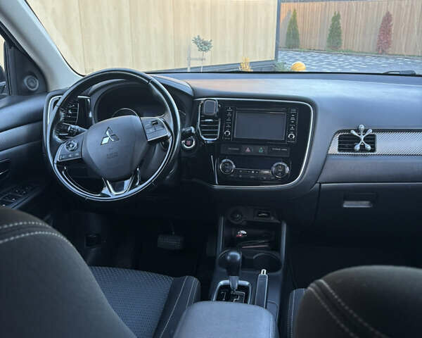 Синий Мицубиси Аутлендер, объемом двигателя 2.38 л и пробегом 99 тыс. км за 15400 $, фото 9 на Automoto.ua