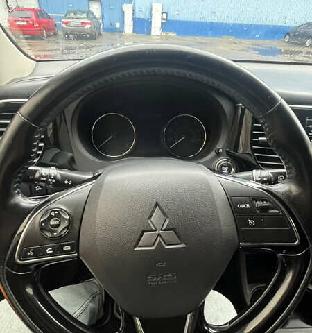 Синий Мицубиси Аутлендер, объемом двигателя 2.36 л и пробегом 203 тыс. км за 14200 $, фото 4 на Automoto.ua