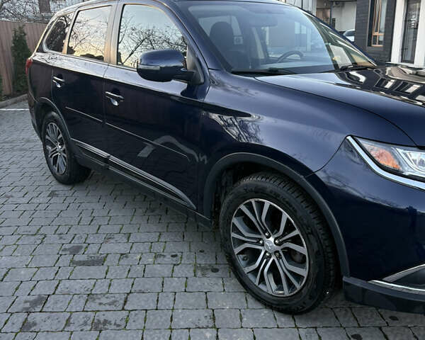 Синий Мицубиси Аутлендер, объемом двигателя 2.38 л и пробегом 99 тыс. км за 15400 $, фото 7 на Automoto.ua