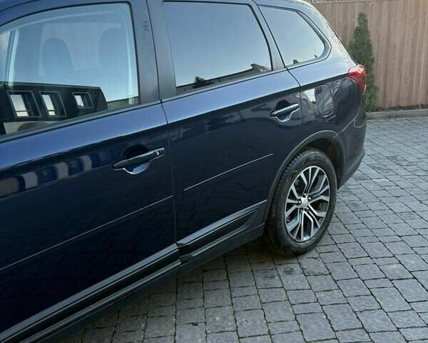 Синий Мицубиси Аутлендер, объемом двигателя 2.38 л и пробегом 99 тыс. км за 15400 $, фото 2 на Automoto.ua