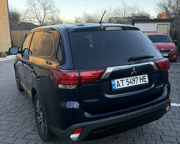 Синий Мицубиси Аутлендер, объемом двигателя 2.38 л и пробегом 99 тыс. км за 15400 $, фото 4 на Automoto.ua