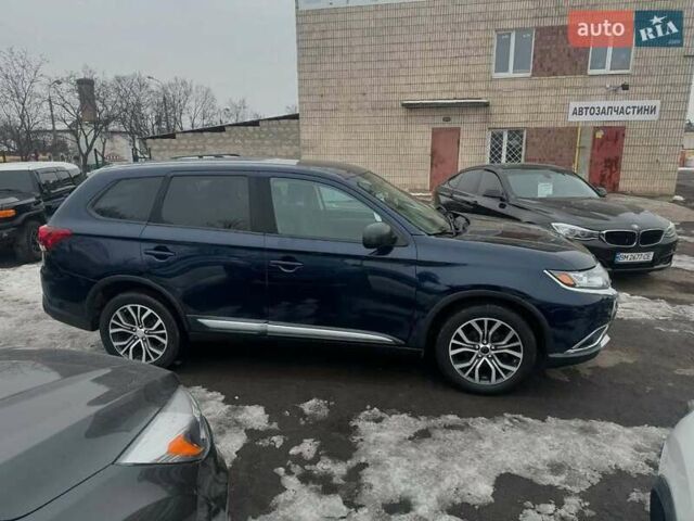 Синий Мицубиси Аутлендер, объемом двигателя 2.36 л и пробегом 195 тыс. км за 13450 $, фото 3 на Automoto.ua