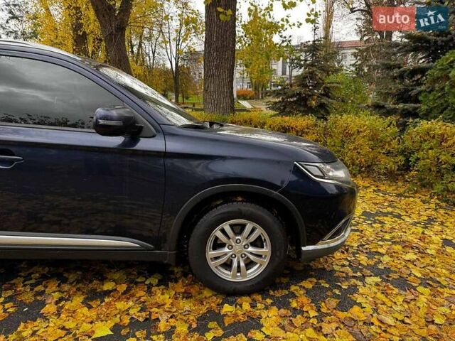 Синий Мицубиси Аутлендер, объемом двигателя 2 л и пробегом 238 тыс. км за 14940 $, фото 4 на Automoto.ua