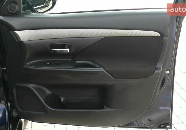 Синій Міцубісі Аутлендер, об'ємом двигуна 2.36 л та пробігом 161 тис. км за 14400 $, фото 21 на Automoto.ua