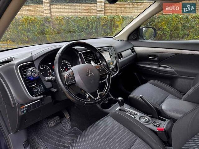 Синий Мицубиси Аутлендер, объемом двигателя 2 л и пробегом 238 тыс. км за 14940 $, фото 11 на Automoto.ua
