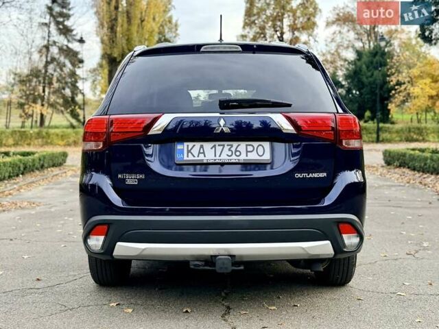 Синий Мицубиси Аутлендер, объемом двигателя 3 л и пробегом 123 тыс. км за 15900 $, фото 5 на Automoto.ua