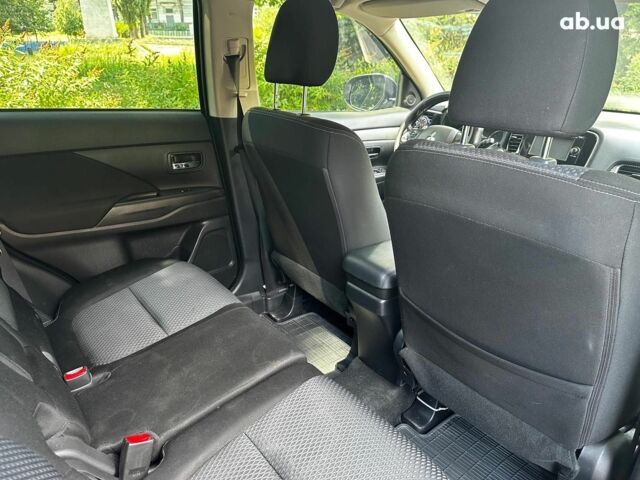 Синій Міцубісі Аутлендер, об'ємом двигуна 2 л та пробігом 238 тис. км за 15990 $, фото 22 на Automoto.ua