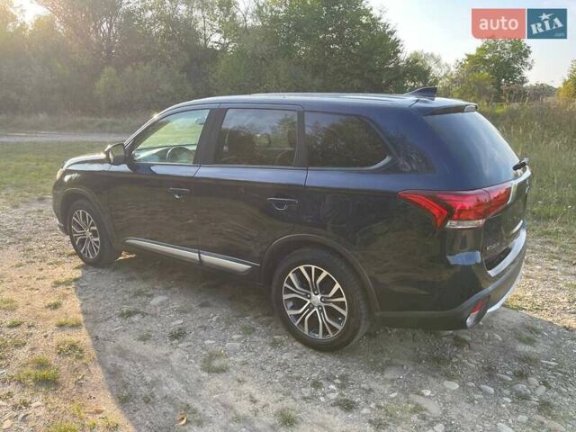 Синий Мицубиси Аутлендер, объемом двигателя 2.4 л и пробегом 221 тыс. км за 12300 $, фото 7 на Automoto.ua