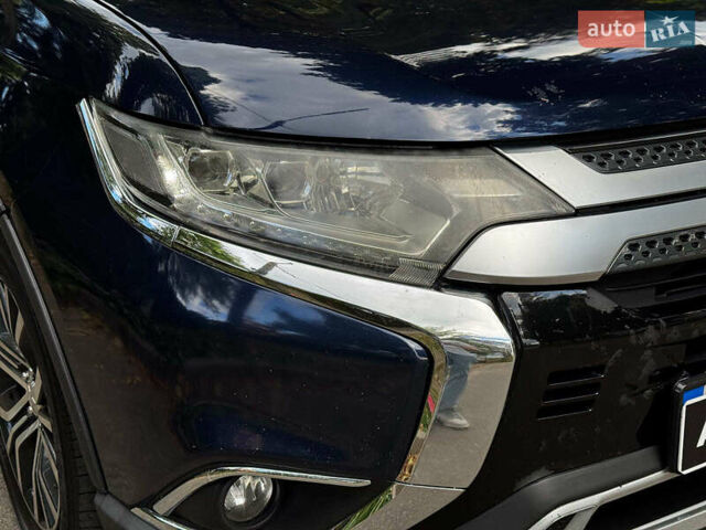 Синий Мицубиси Аутлендер, объемом двигателя 2.4 л и пробегом 144 тыс. км за 15490 $, фото 1 на Automoto.ua