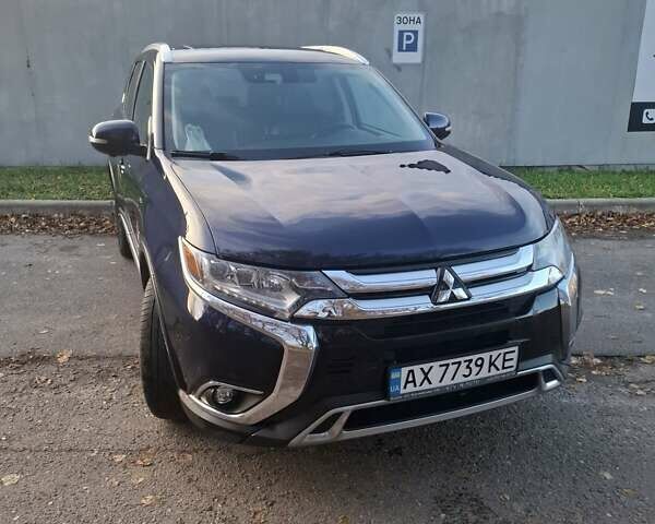 Синий Мицубиси Аутлендер, объемом двигателя 3 л и пробегом 93 тыс. км за 21500 $, фото 1 на Automoto.ua
