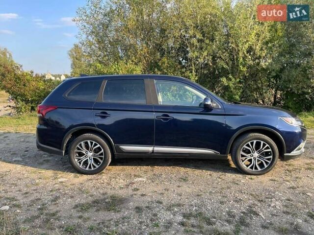 Синий Мицубиси Аутлендер, объемом двигателя 2.4 л и пробегом 221 тыс. км за 12300 $, фото 5 на Automoto.ua