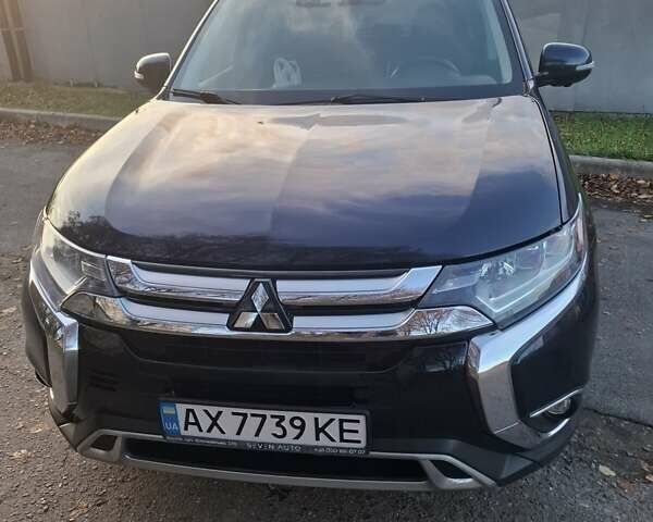 Синий Мицубиси Аутлендер, объемом двигателя 3 л и пробегом 93 тыс. км за 21500 $, фото 2 на Automoto.ua