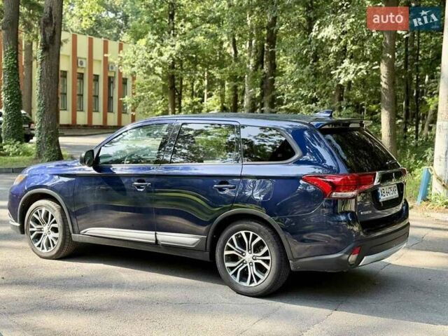 Синий Мицубиси Аутлендер, объемом двигателя 2.4 л и пробегом 102 тыс. км за 15000 $, фото 22 на Automoto.ua