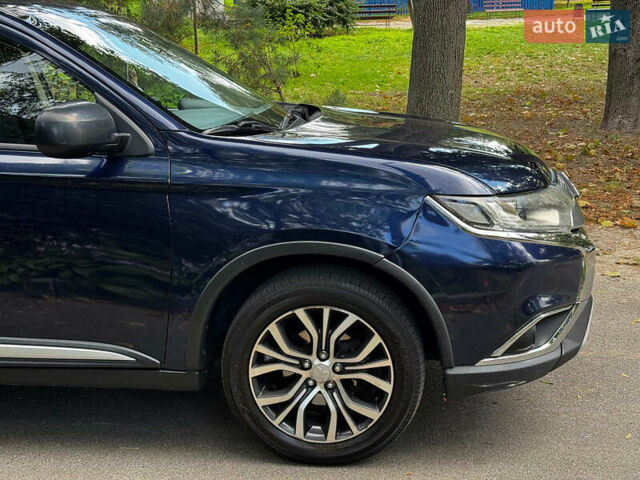 Синий Мицубиси Аутлендер, объемом двигателя 2.4 л и пробегом 144 тыс. км за 15490 $, фото 4 на Automoto.ua