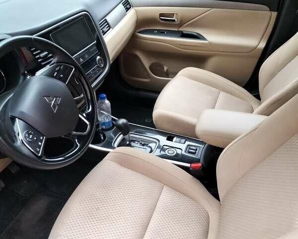 Синий Мицубиси Аутлендер, объемом двигателя 2.42 л и пробегом 135 тыс. км за 17000 $, фото 3 на Automoto.ua