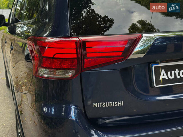 Синий Мицубиси Аутлендер, объемом двигателя 2.4 л и пробегом 144 тыс. км за 15490 $, фото 5 на Automoto.ua