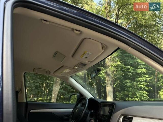 Синий Мицубиси Аутлендер, объемом двигателя 2.4 л и пробегом 102 тыс. км за 15000 $, фото 8 на Automoto.ua