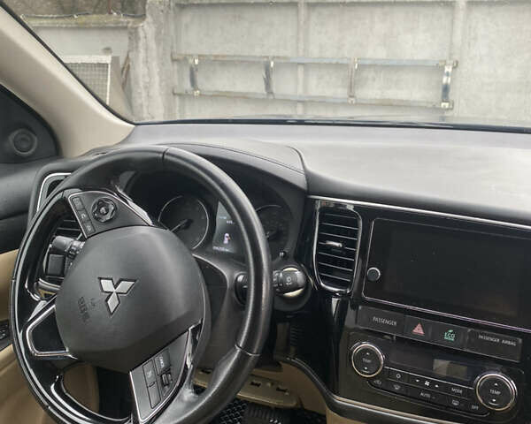 Синий Мицубиси Аутлендер, объемом двигателя 2.36 л и пробегом 155 тыс. км за 13700 $, фото 11 на Automoto.ua