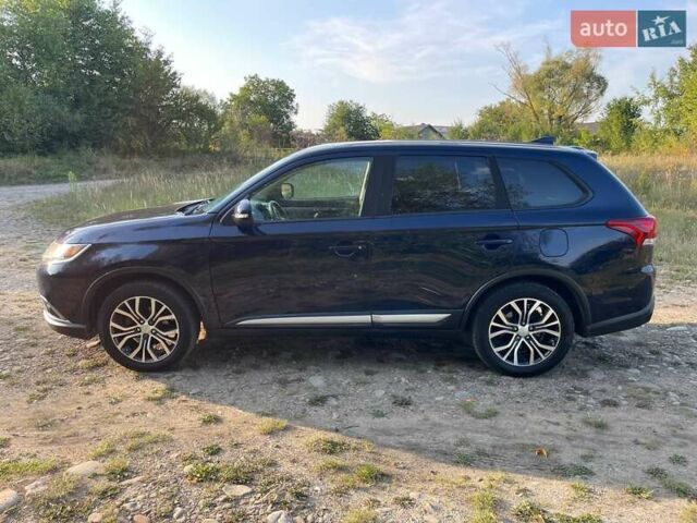 Синий Мицубиси Аутлендер, объемом двигателя 2.4 л и пробегом 221 тыс. км за 12300 $, фото 4 на Automoto.ua