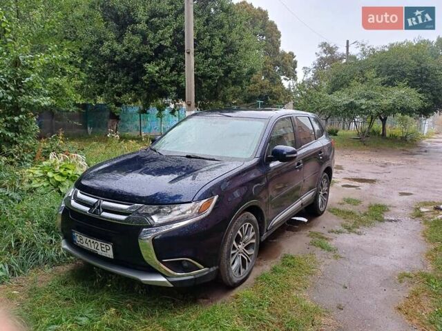 Синий Мицубиси Аутлендер, объемом двигателя 2.42 л и пробегом 135 тыс. км за 17000 $, фото 2 на Automoto.ua