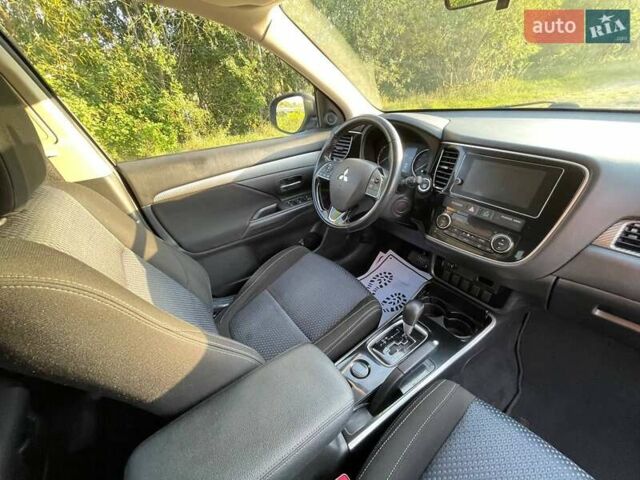 Синий Мицубиси Аутлендер, объемом двигателя 2.4 л и пробегом 221 тыс. км за 12300 $, фото 19 на Automoto.ua