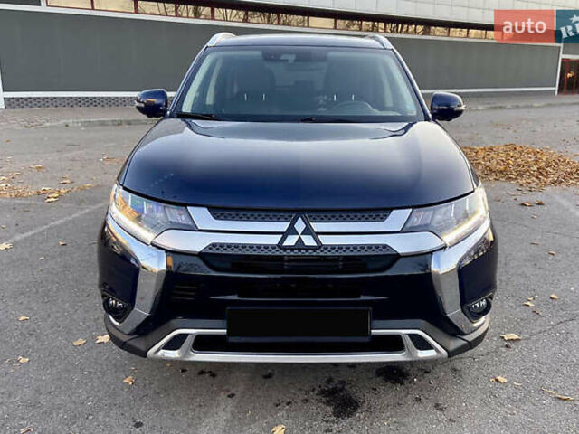Синий Мицубиси Аутлендер, объемом двигателя 2.36 л и пробегом 71 тыс. км за 13800 $, фото 1 на Automoto.ua