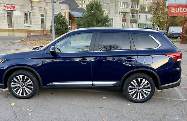 Синий Мицубиси Аутлендер, объемом двигателя 2.36 л и пробегом 71 тыс. км за 13800 $, фото 3 на Automoto.ua