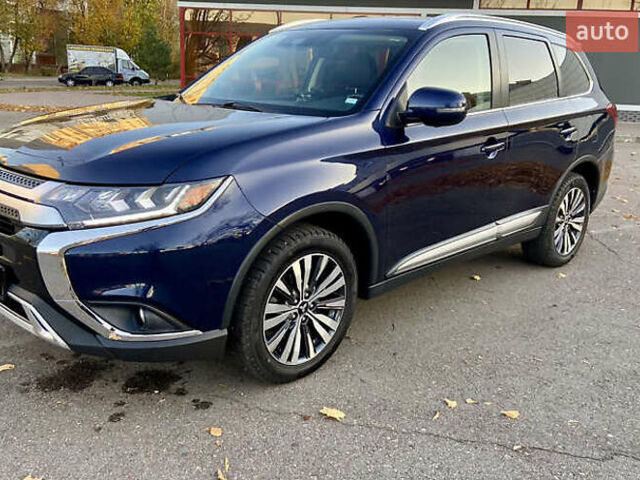 Синий Мицубиси Аутлендер, объемом двигателя 2.36 л и пробегом 71 тыс. км за 13800 $, фото 2 на Automoto.ua