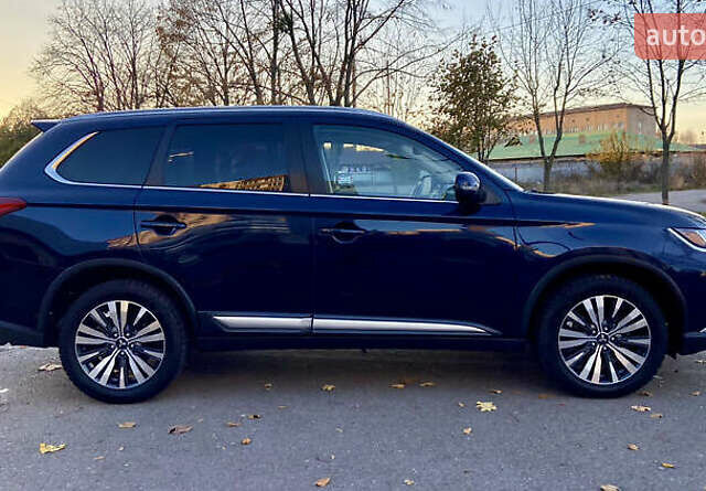 Синий Мицубиси Аутлендер, объемом двигателя 2.36 л и пробегом 71 тыс. км за 13800 $, фото 8 на Automoto.ua